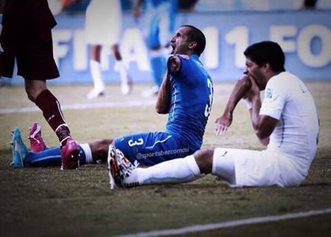 Suarez Eating A Players Hand.jpg